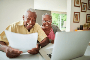 Man_Woman_Black_60s-70s_ReviewingDocuments_HomeOffice
